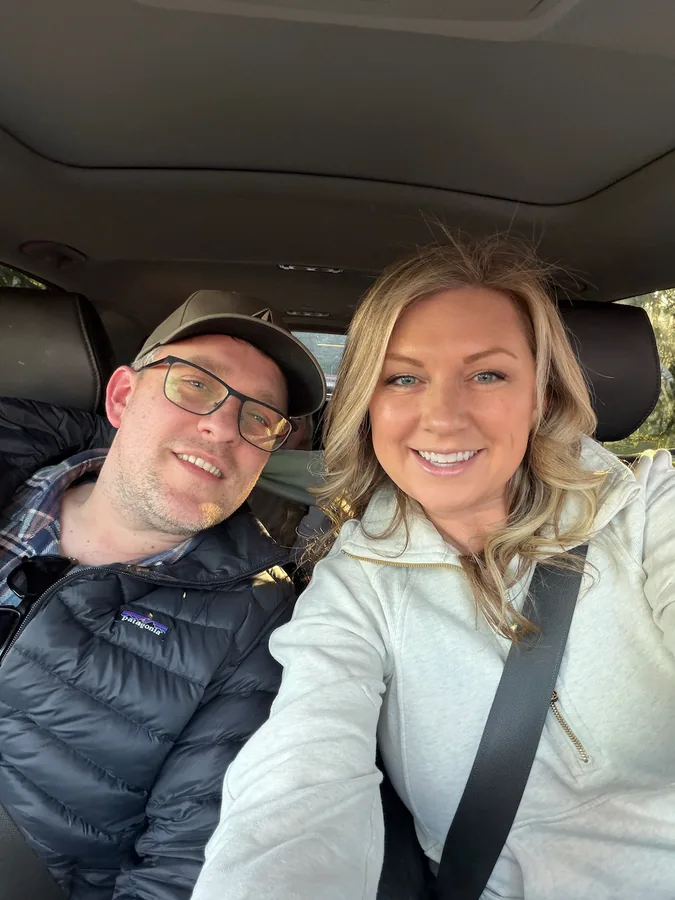 Phil and his wife in the car.